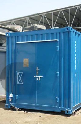 Blue container fabricated at the workshop beside a forklift
